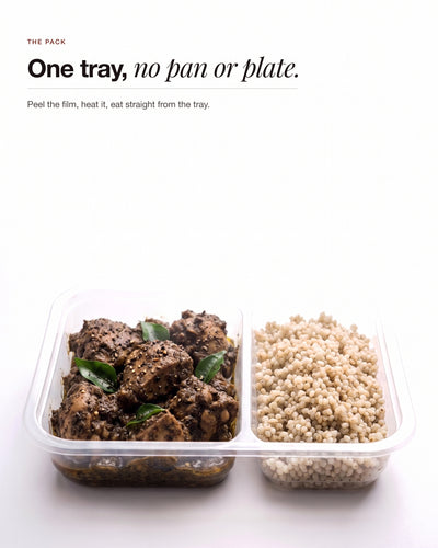 Chettinad Pepper Chicken in its two compartment tray, curry beside pearl millet