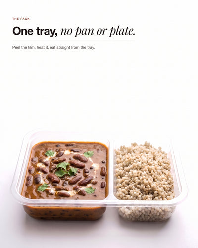 Dal Makhani in its two compartment tray, dal beside pearl millet