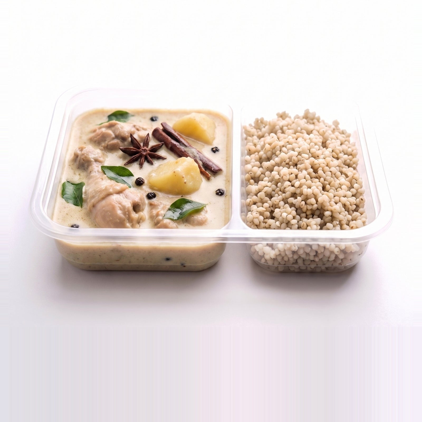 Kerala Chicken Ishtu, the open tray with coconut stew beside pearl millet