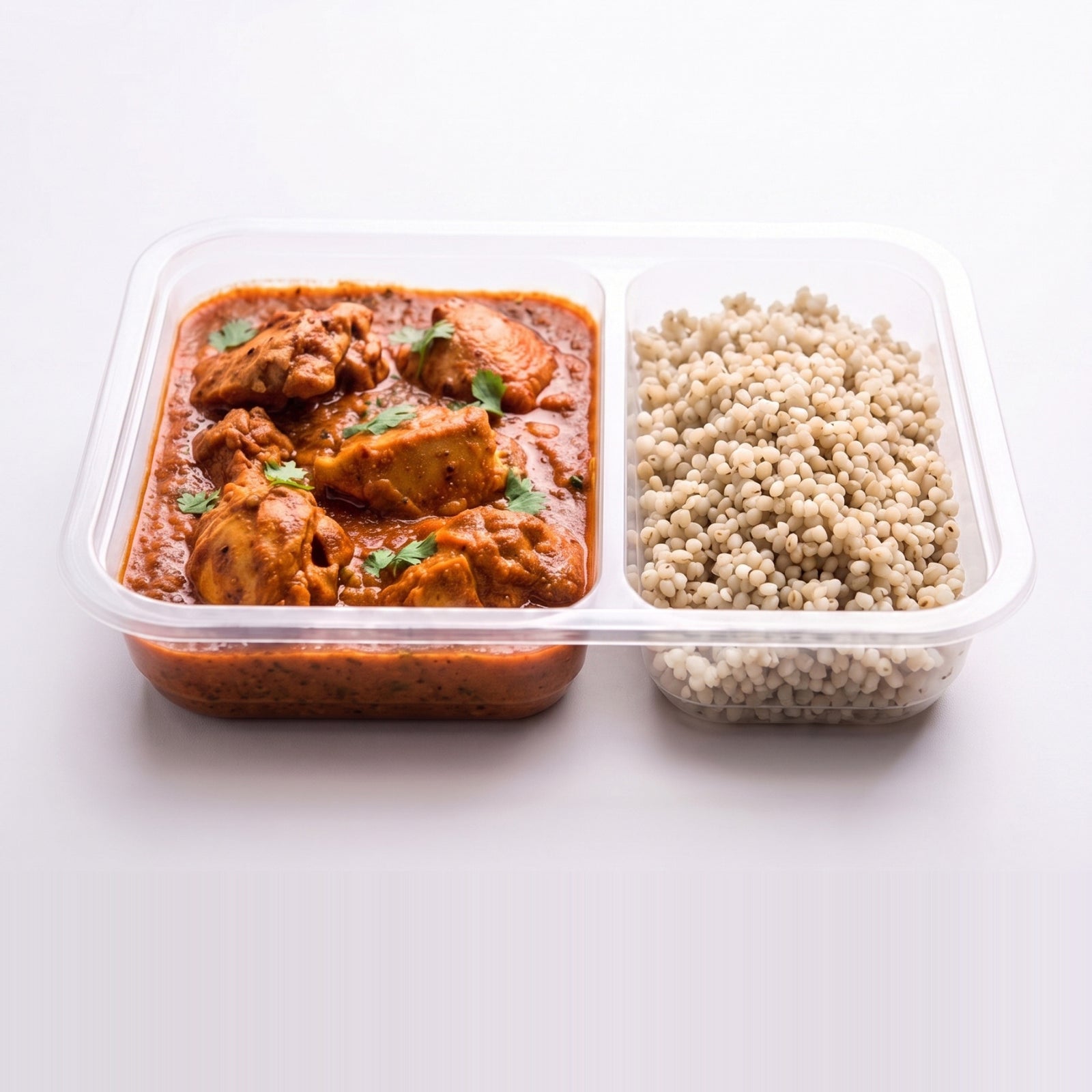 Kolhapuri Chicken Bowl, the open tray with Kolhapuri gravy beside pearl millet
