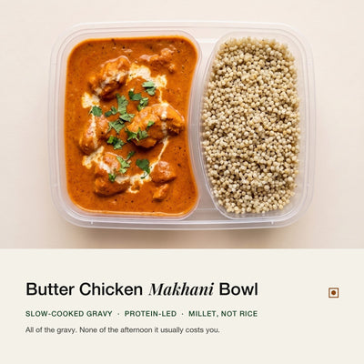 Butter Chicken Bowl opened: gravy in one compartment, pearl millet in the other