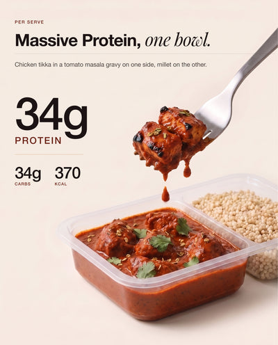 A forkful of Chicken Tikka Masala lifted from the open bowl