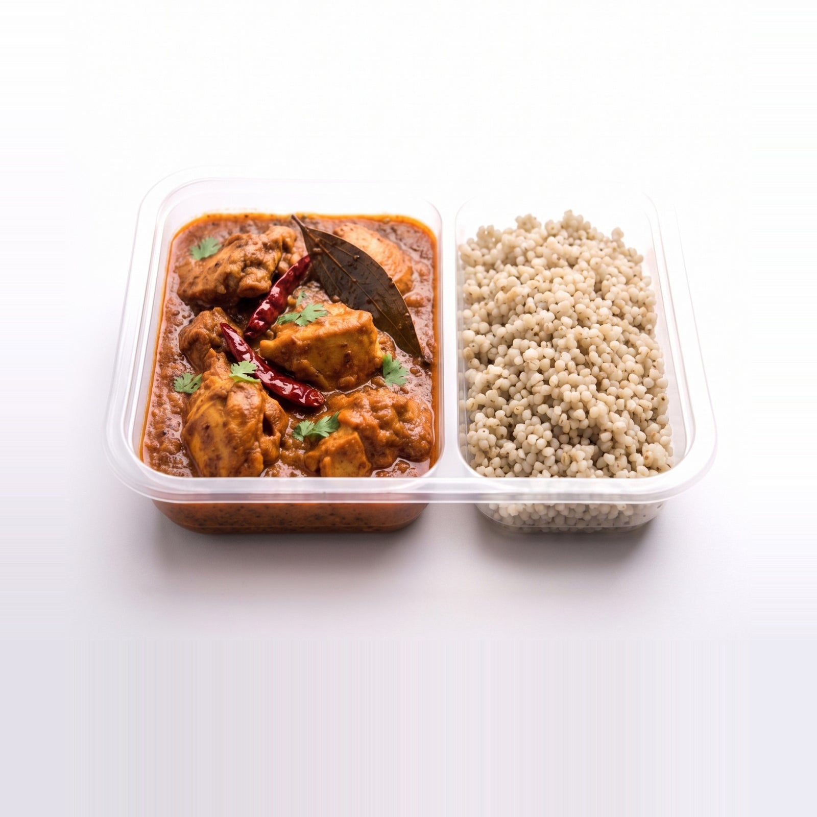 Goan Vindaloo Chicken Bowl, the open tray with vindaloo beside pearl millet
