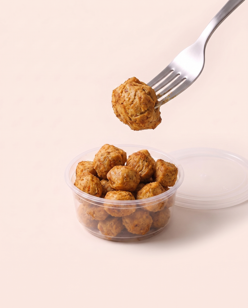 Soya High Protein Top-up in its tub, a forkful lifted, ready to eat