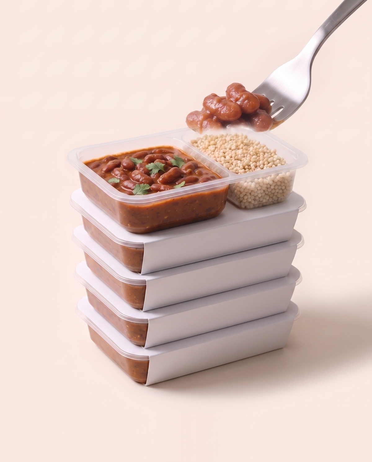 Week Stack, five Fuel lunch boxes stacked, the top tray open to the food