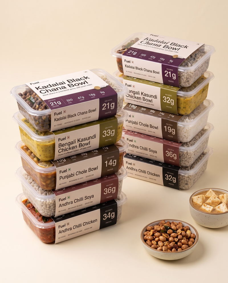 Deep Stack, ten Fuel boxes in their printed sleeves in two piles with two protein top-up tubs in front